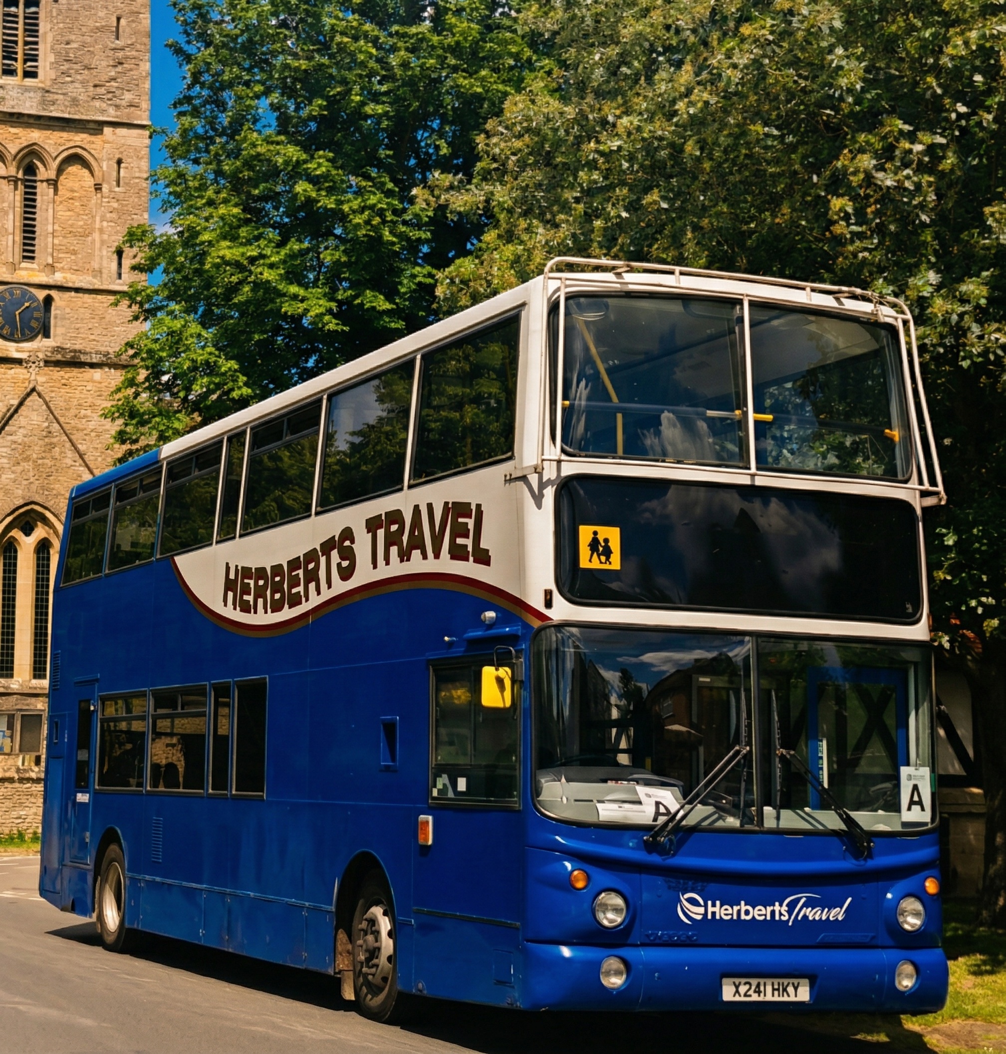 Herberts Travel school bus by village church